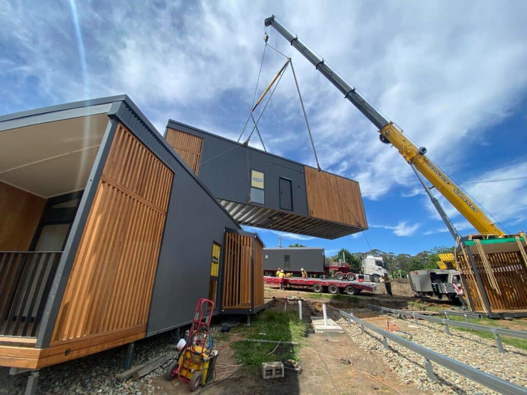 Fabricated unit being lifted by crane.