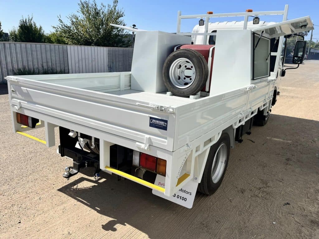 Manufactured truck tray with doors open.