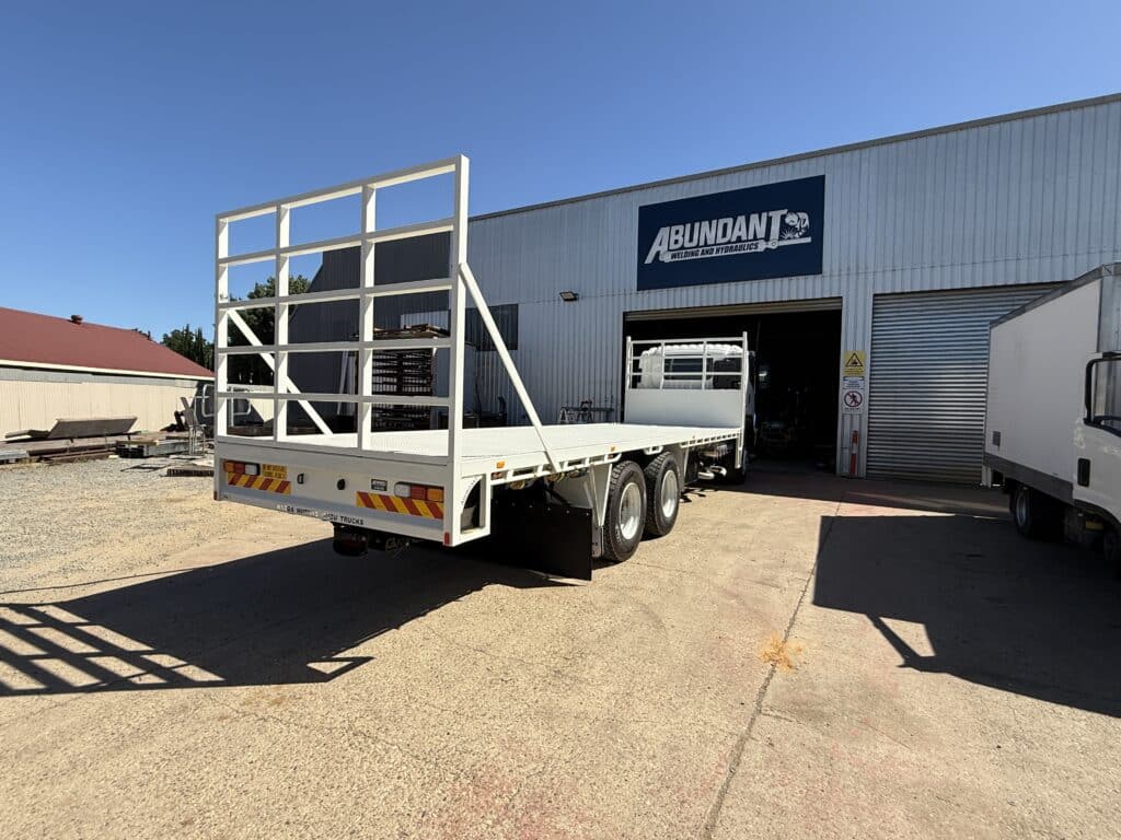 Abundant 7.5m tray with Bartlett towbar, rear view.