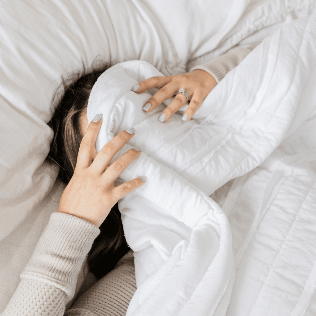 Woman frustrated because she can't sleep due to perimenopause