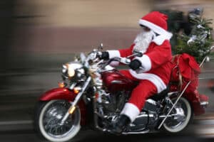 Santa riding a motor bike spreading the spirit of Christmas