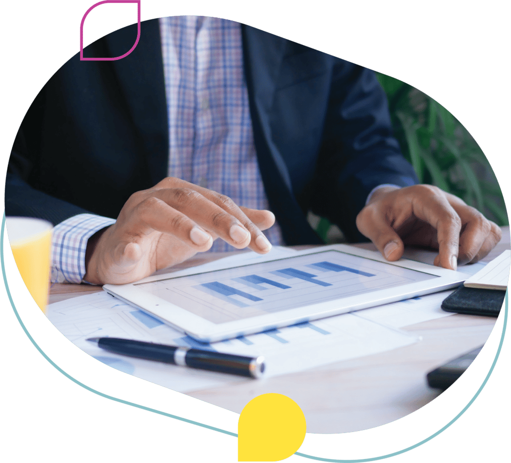 A businessman analyzing data on a tablet.
