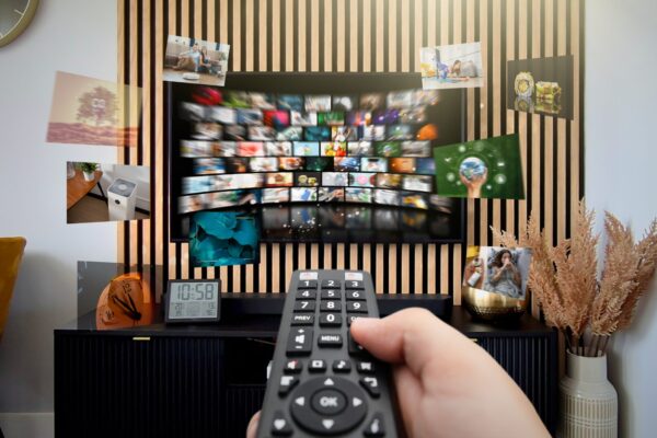 Vod,Multimedia,Tv,Streaming,Concept,With,Hand,Holding,Remote,Control